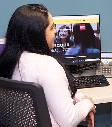 B.P.S. student at a computer